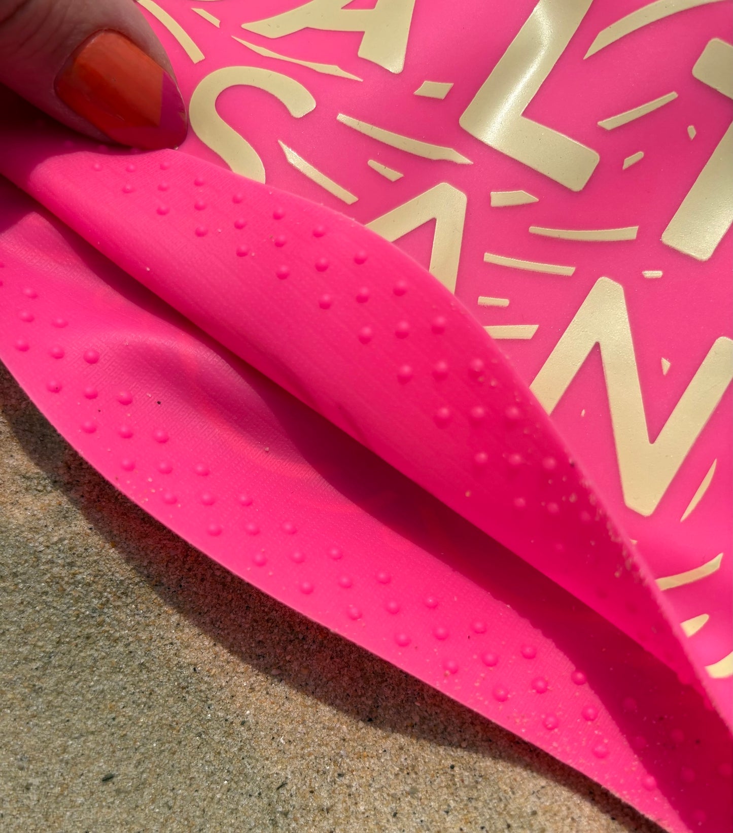 Close-up of soft grip bobbles inside Salty & Sane silicone swim hat