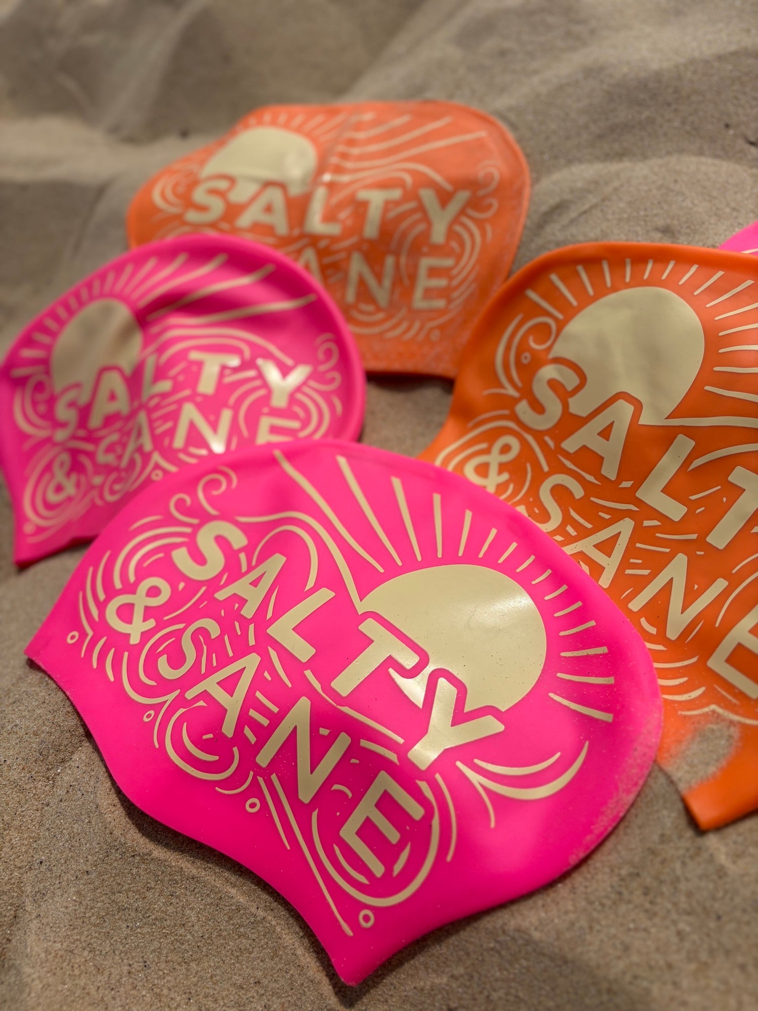Pink and Orange silicone swim hats for long hair by Salty & Sane